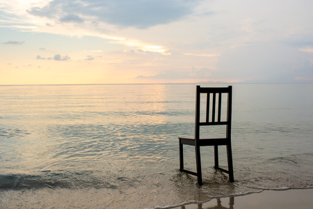 Chair on the beach with sunset.の写真素材