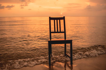 Chair on the beach with sunset.の写真素材