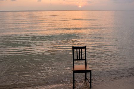 Chair on the beach with sunset.の写真素材