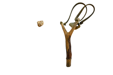 Catapult is shooting rocks. Isolated on a white background.の写真素材