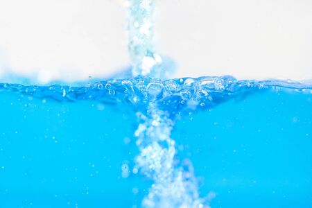 surface blue water wave with air bubblesの写真素材