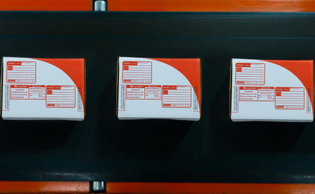 The parcel on the roller conveyor in distribution center. E-commerce and transportation are growing...