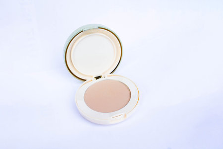 powder compact with mirror on white