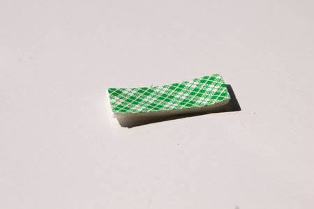 Green and white checkered napkin isolated on white background.の写真素材