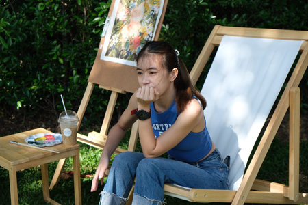 girl sitting in the garden on the green grass