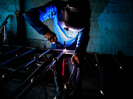 Technician welding aluminum door with electric welding machine.の写真素材