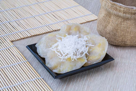 Banana dessert with coconut topping, product of Thailandの写真素材