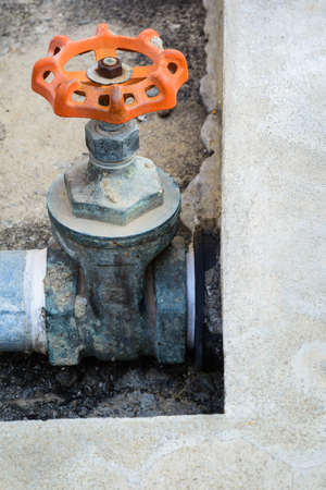 Old water valve and steel pipe rusty on itの写真素材