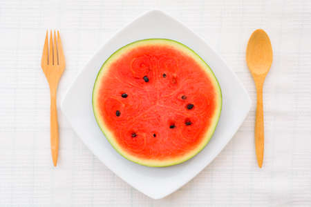 A fresh watermelon slice on a tablewareの写真素材