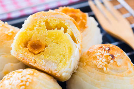 Chinese pastry with egg yolk and white sesameの写真素材