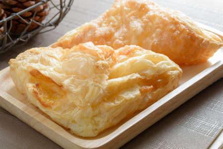 Beautiful pineapple pie in wooden plateの写真素材