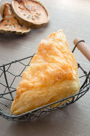 Beautiful pineapple pie in a basketの写真素材