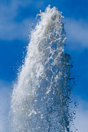 Water fountain and blue skyの写真素材