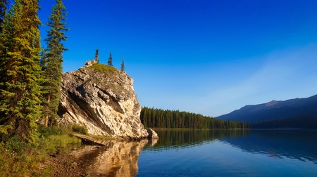 morning mood by the lake as seen in the wilderness of banff national park, alberta, canada.の写真素材