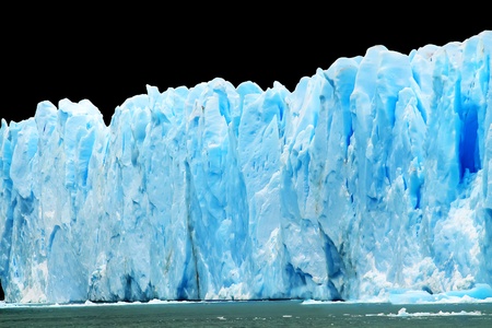 Blue icebergs isolated on black.の写真素材