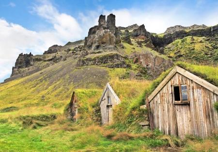 Beautiful landscape with traditional turf houses at Nupsstadur farm near Skaftafell National Park, Sandar region, Icelandの写真素材