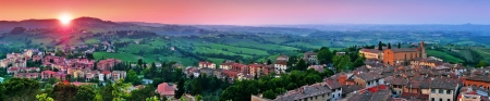 Panoramic view of beautiful landscape with the medieval city of San Gimignano at sunset in Tuscany, province of Siena, Italyの写真素材