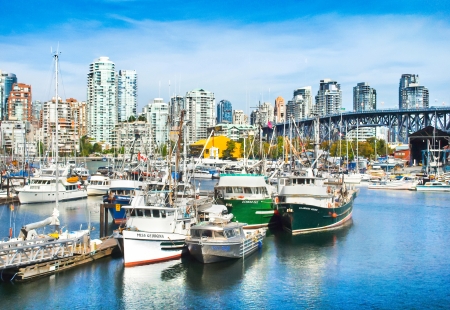 Beautiful view of Vancouver skyline with Granville bridge and ships lying in harbor at False Creek, British Columbia, Canadaのeditorial素材
