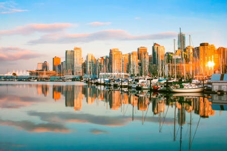 Beautiful view of Vancouver skyline with harbor at sunset, British Columbia, Canadaの写真素材
