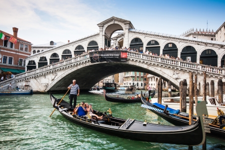 Traditional Gondolas on Canal Grande with famous Rialto bridge in the background, Venice, Italyのeditorial素材