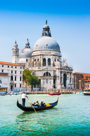 Traditional Gondola on Canal Grande with Basilica di Santa Maria della Salute in the background, Venice, Italyの写真素材