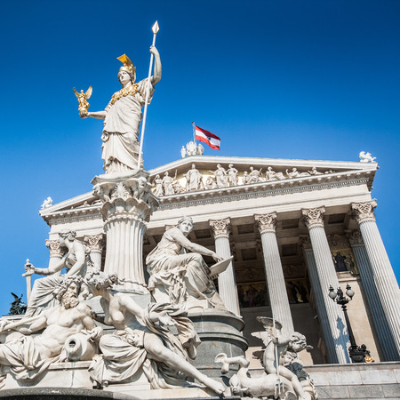 Beautiful view of Austrian parliament building with famous Pallas Athena fountain in Vienna, Austriaの写真素材