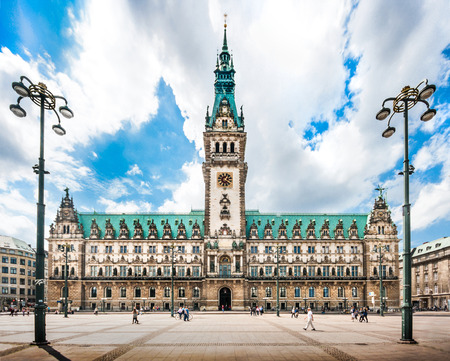 Famous Hamburg town hall with dramatic clouds and blue sky at market square near lake Binnenalster in Altstadt quarter, Hamburg, Germanyのeditorial素材