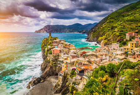 Beautiful view of Vernazza, one of the five famous fisherman villages of Cinque Terre with dramatic cloudscape at sunset in Liguria, Italyの写真素材