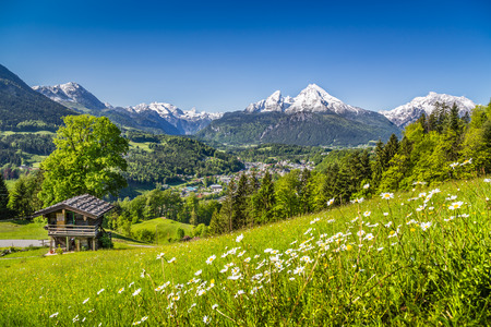 Beautiful mountain landscape in the Bavarian Alps with village of Berchtesgaden and Watzmann massif in the background at sunrise, Nationalpark Berchtesgadener Land, Bavaria, Germanyの写真素材