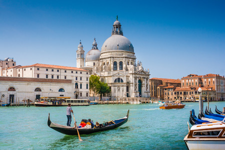 Traditional Gondola on Canal Grande with Basilica di Santa Maria della Salute in the background, Venice, Italyの写真素材