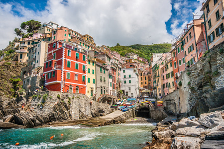 Panoramic view of Riomaggiore, one of the five famous fisherman villages of Cinque Terre in Liguria, Italyの写真素材