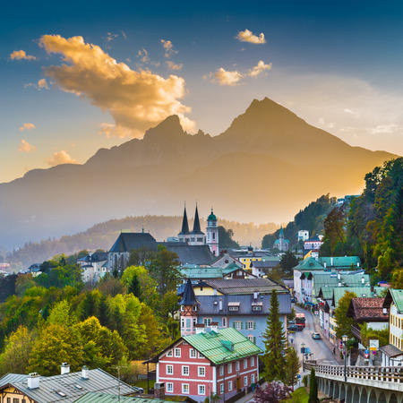 Mountain village of Berchtesgaden with Watzmann mountain silhouette in the background at sunset, Nationalpark Berchtesgadener Land, Bavaria, Germanyの写真素材