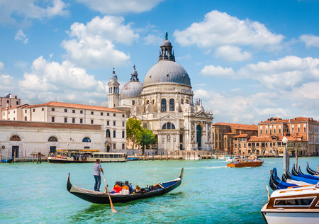 Traditional Gondola on Canal Grande with Basilica di Santa Maria della Salute in the background, Venice, Italyの写真素材