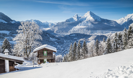 Beautiful mountain landscape in the Bavarian Alps with village of Berchtesgaden and Watzmann massif in the background at sunrise, Nationalpark Berchtesgadener Land, Bavaria, Germanyの写真素材