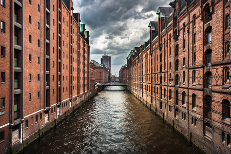 Famous Speicherstadt warehouse district with dark clouds before the storm in Hamburg, Germanyの写真素材