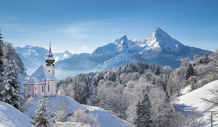 Panoramic view of beautiful winter landscape in the Bavarian Alps with pilgrimage church of Maria Gern and famous Watzmann massif in the background, Nationalpark Berchtesgadener Land, Bavaria, Germany