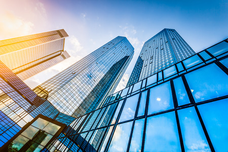 Modern skyscrapers in business district at sunset