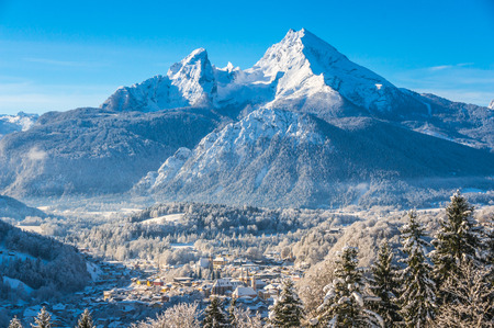 Beautiful mountain landscape in the Bavarian Alps with village of Berchtesgaden and Watzmann massif in the background at sunrise, Nationalpark Berchtesgadener Land, Bavaria, Germanyの写真素材