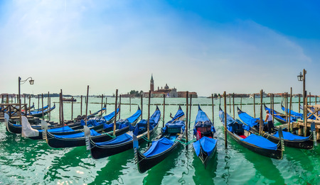 Beautiful view of traditional Gondolas on Canal Grande with San Giorgio Maggiore church in the background at morning, San Marco, Venice, Italyの写真素材