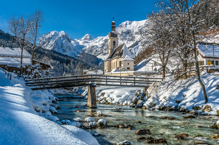Panoramic view of scenic winter landscape in the Bavarian Alps with famous Parish Church of St. Sebastian in the village of Ramsau, Nationalpark Berchtesgadener Land, Upper Bavaria, Germanyの写真素材