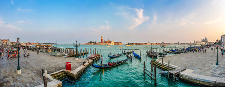 Beautiful view of traditional Gondola on Canal Grande with San Giorgio Maggiore church in the background at sunset, San Marco, Venice, Italyの写真素材