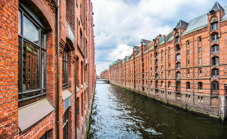 Famous Speicherstadt warehouse district with dark clouds before the storm in Hamburg, Germanyの写真素材