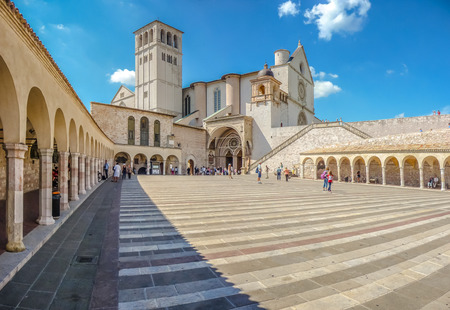 Famous Basilica of St. Francis of Assisi Basilica Papale di San Francesco with Lower Plaza in Assisi, Umbria, Italyの写真素材