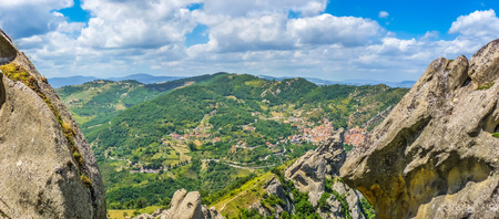 Panoramic view of the famous Lucan Dolomites with beautiful mountain village of Castelmezzano, one of 'The most beautiful villages in Italy' from Pietrapertosa in Basilicata, Italyの写真素材