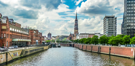 Panoramic view of famous Zollkanal with the historic St. Catherine's Church Katharinenkirche, and old bridge in the Speicherstadt warehouse district of Hamburg, Germanyの写真素材