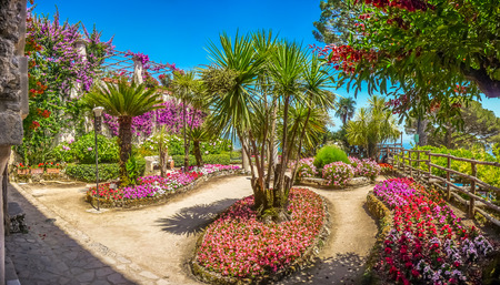 Scenic picture-postcard view of beautiful idyllic Villa Rufolo gardens in Ravello at famous Amalfi Coast with Gulf of Salerno, Campania, Italyの写真素材