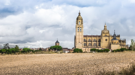 Catedral de Santa Maria de Segovia in the historic city of Segovia with dramatic cloudscape, Castilla y Leon, Spainの写真素材