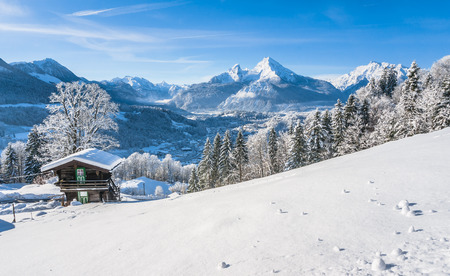 Beautiful mountain landscape in the Bavarian Alps with village of Berchtesgaden and Watzmann massif in the background at sunrise, Nationalpark Berchtesgadener Land, Bavaria, Germanyの写真素材