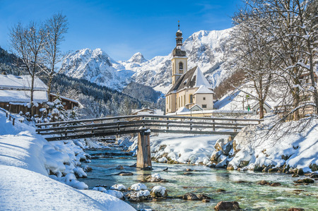 Panoramic view of scenic winter landscape in the Bavarian Alps with famous Parish Church of St. Sebastian in the village of Ramsau, Nationalpark Berchtesgadener Land, Upper Bavaria, Germany