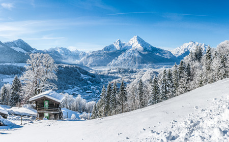 Beautiful mountain landscape in the Bavarian Alps with village of Berchtesgaden and Watzmann massif in the background at sunrise, Nationalpark Berchtesgadener Land, Bavaria, Germanyの写真素材